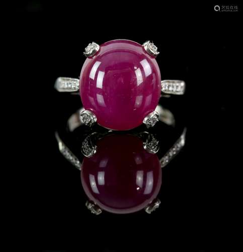 Ruby and diamond ring, with an oval cabochon cut stone, in platinum mount set with diamonds, ruby