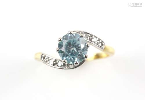Zircon and diamond twist ring, central round cut blue zircon, estimated weight 2.39 carats, Swiss