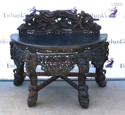 Chinese carved console table, with gallery back carved with a dragon above pierced frieze and