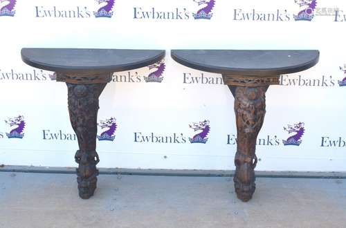 Pair of Chinese carved console tables, each with a pierced frieze above a single carved and shaped