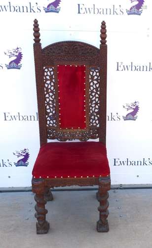 Far Eastern hardwood chair, with scrolling foliate decoration and velour backrest and seat on