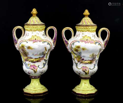 Pair of Continental pottery two handled vases and covers painted with lovers in landscape