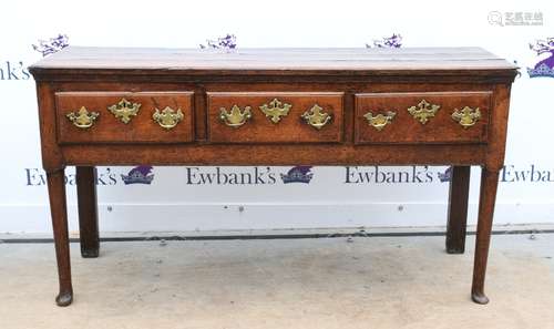 18th/19th century oak dresser base with three drawers on turned supports and pad feet, h76cm x