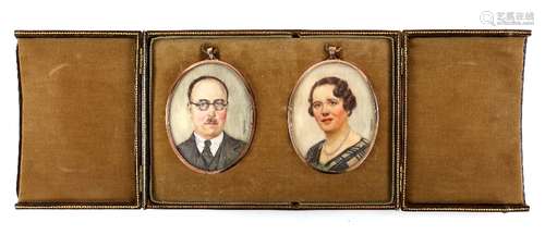 Late 19th century pair of portrait miniatures of a gentleman and a lady, on ivory, in gilt-metal