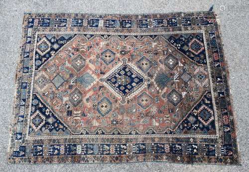 Antique Kazakh orange ground rug, central diamond medallion on a orange ground with repeating