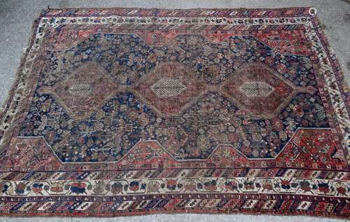 Persian blue ground rug, with red ground triple pole medallion on a blue ground with repeating