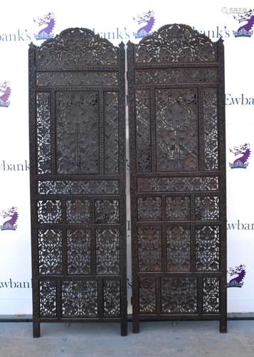 Indian carved wooden two panel room screen, with pierced floral decoration, hinges broken, each