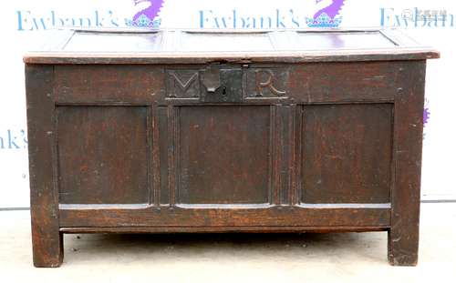 18th century oak coffer with panelled decoration on square supports, carved with the initials '