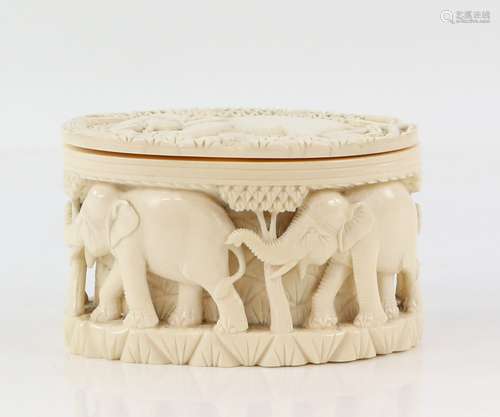 Early 20th century Indian carved ivory jar and cover decorated with elephants, 8.5cm high,PLEASE