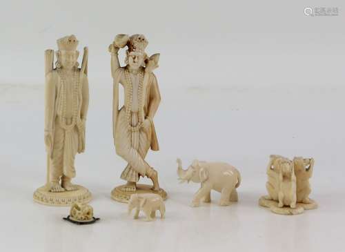 Two early 20th century Indian carved ivory figures, possibly chess pieces, three wise monkeys etc.,