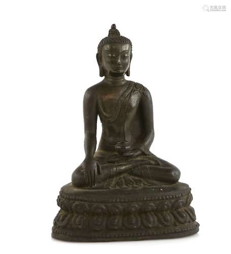 An Asian metal alloy figure of a Buddhist Deity, possibly Sakyamuni The Historical Deity; seated