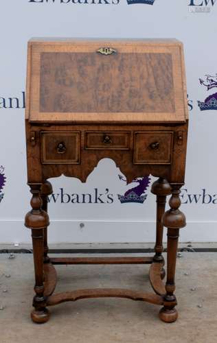 Early 20th century walnut bureau with fall flap over three drawers on turned supports, h91cm x w48cm