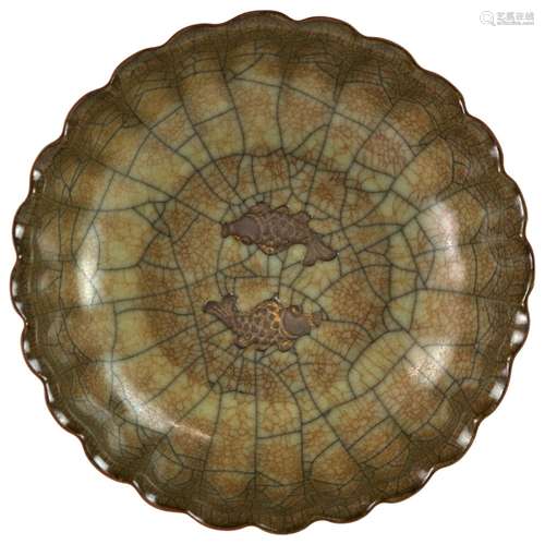 A Guanyao style circular bowl with foliate rim, decorated in the well with a pair of fish; the