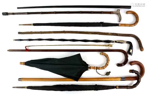 A collection of 21 vintage walking sticks , canes and umbrellas including cane with silver pommel,