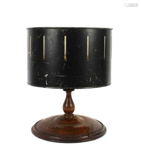 Victorian zoetrope with revolving canister on turned mahogany support and spreading base, with