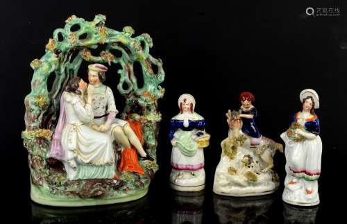 Staffordshire figural group of a man and a woman, probably Romeo and Juliet, seated under an arbour,