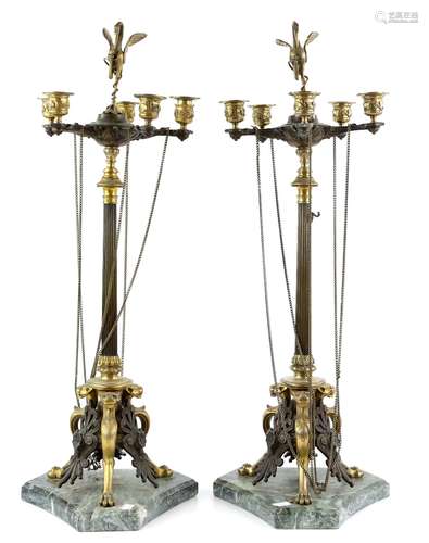 Pair of Neo Classical style bronzed five arm table candelabra with crane finials on lion footed