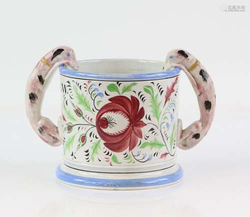 Frog mug modelled with twin handles in the form of dogs, floral decoration and the initials B.W.