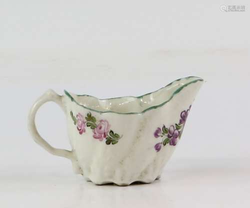 Chelsea cream jug, 18th century, spirally moulded with leaves to the base, painted with purple and