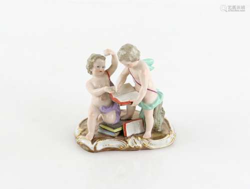 Meissen porcelain figural group depicting two putti, one holding aloft an ink well and the other