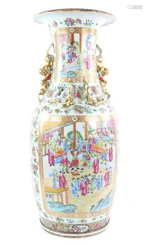 A large Canton famille rose vase with trumpet neck, decorated with typical panels of Manchu/