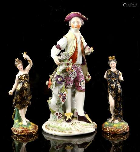 18th century Derby figure of a gardener wearing floral breeches, coat and hat, patch marks 24cm high