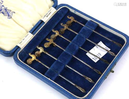 George V silver-gilt set of six cockerel finial cocktail sticks, Birmingham 1934, 8.5 cm long, 51