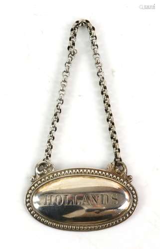 Victorian silver decanter label for Hollands. by James Dixon and Sons, Sheffield 1877,5.5 cm wide,