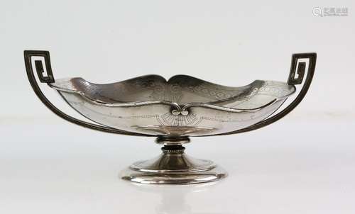 Silver bread or fruit stand, the shaped oval bowl with pin-prick decoration and twin handles,