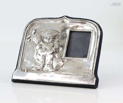 Modern silver photo frame with golfer or golf caddy decoration, by JB Ltd, London 1994, 17.5 cm wide