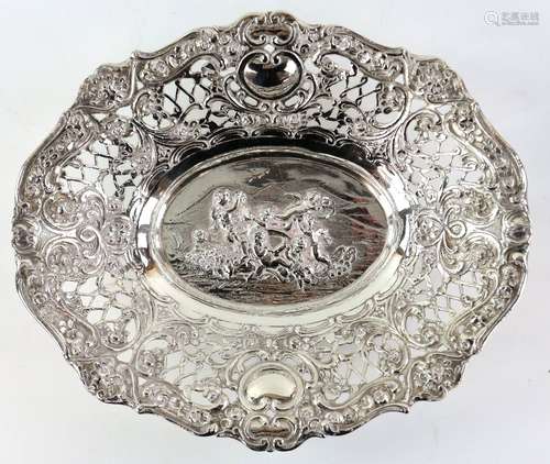 Continental silver dish, the shaped oval body with pierced border, the centre embossed in high