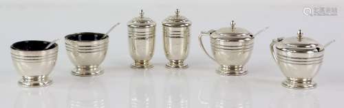 Modern silver cruet set comprising two each of mustard pots, open salts, pepperettes, mustard spoons