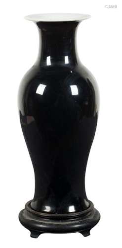 A mirror black monochrome porcelaine bottle vase. …