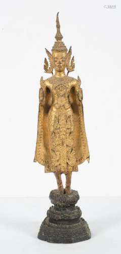 A gilt bronze figure of Buddha. Thailand. Rattanak…