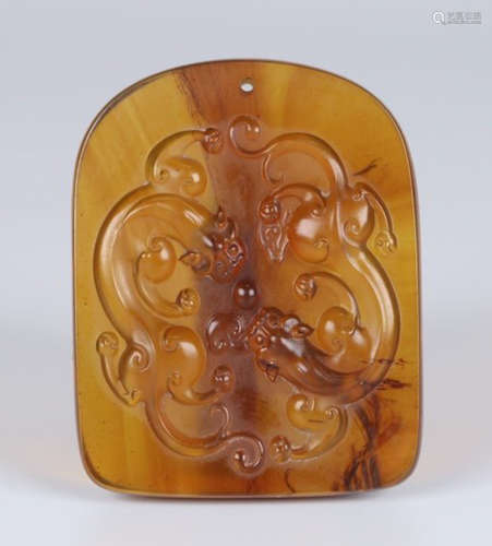 AN AMBER TABLET CARVED WITH DRAGON