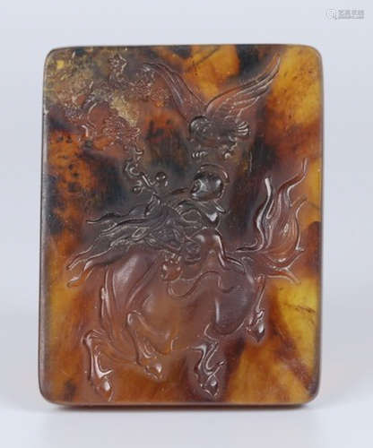 AN AMBER TABLET CARVED WITH FIGURE STORY