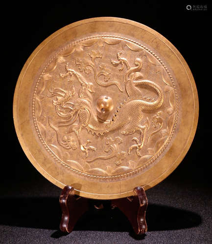 A TIBETAN GILT BRONZE MIRROR CARVED WITH QILIN