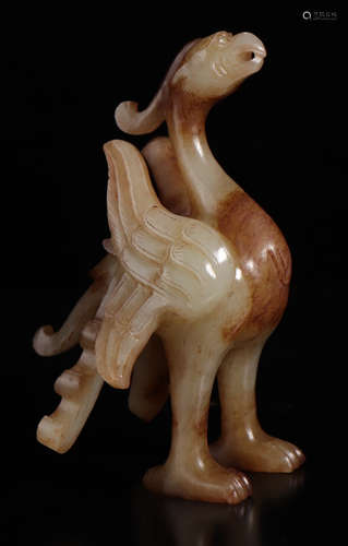 A HETIAN JADE BEAST PENDANT