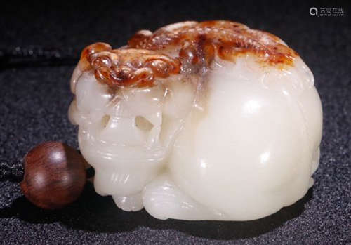 A HETIAN JADE BEAST PENDANT