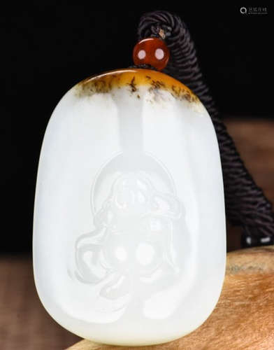 A HETIAN JADE CARVED MAITREYA