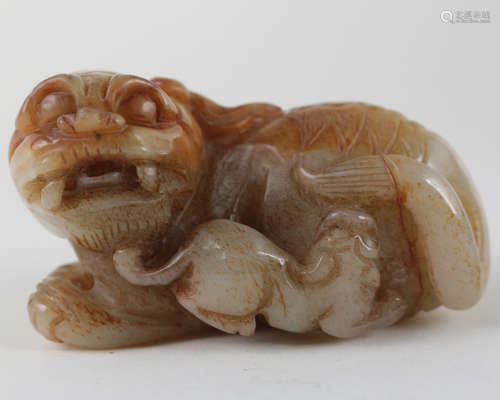 A LIONS CARVED JADE PENDANT