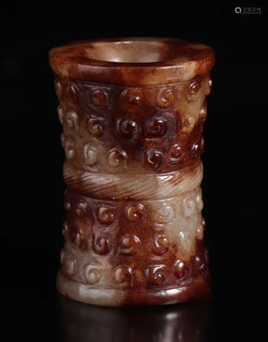 A HETIAN JADE PENDANT CARVED WITH RIVET