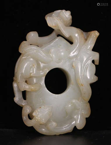 A HETIAN JADE PENDANT CARVED WITH DRAGON