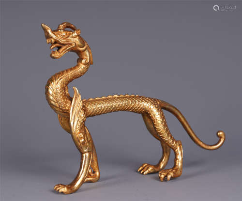 A CHINESE GILT BRONZE WALKING DRAGON TABLE ITEM