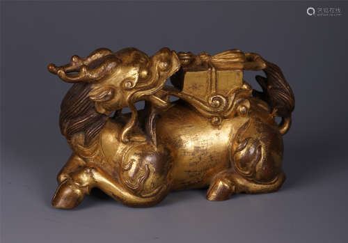 A CHINESE KYLIN CARRYING BOOK ON BACK GILT BRONZE PAPERWEIGHT