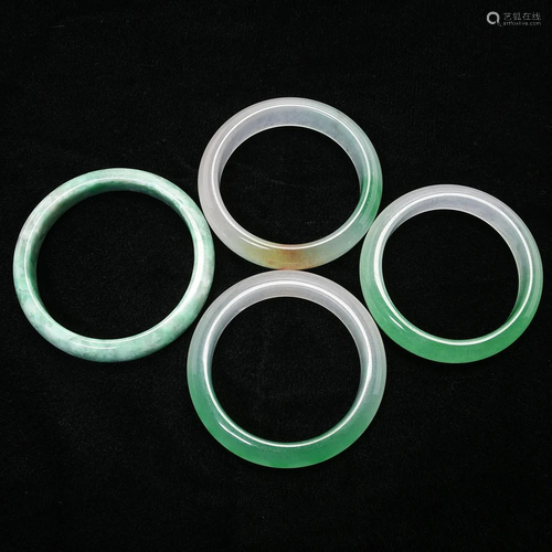 Group of Four Jadeite bangle Bracelets.