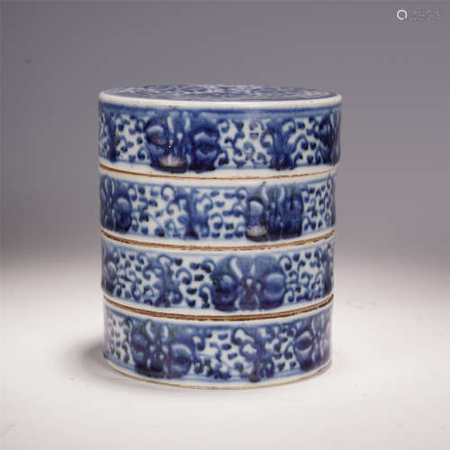 A CHINESE BLUE AND WHITE PORCELAIN TWISTED BRANCH LOTUS PATTERN FOUR LAYER LIDDED BOX