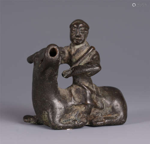 A CHINESE BOY RIDE ON OX SHAPED BRONZE PAPERWEIGHT