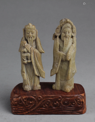 A Pair of Carved Figurines