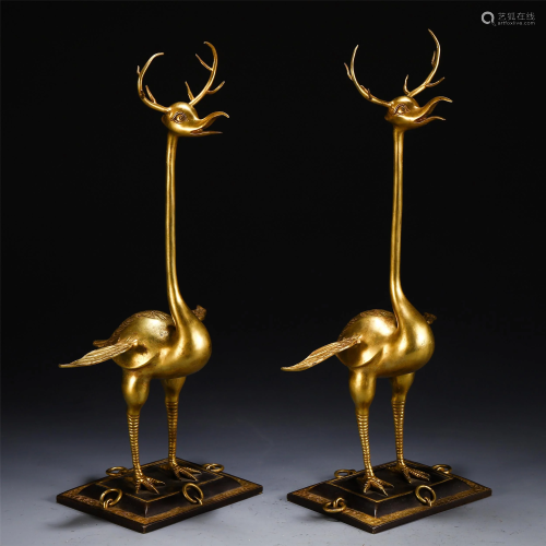 A PAIR OF CHINESE GILT BRONZE BEAST TABLE ITEM